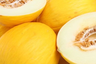 Photo of Whole and cut ripe melons as background, closeup