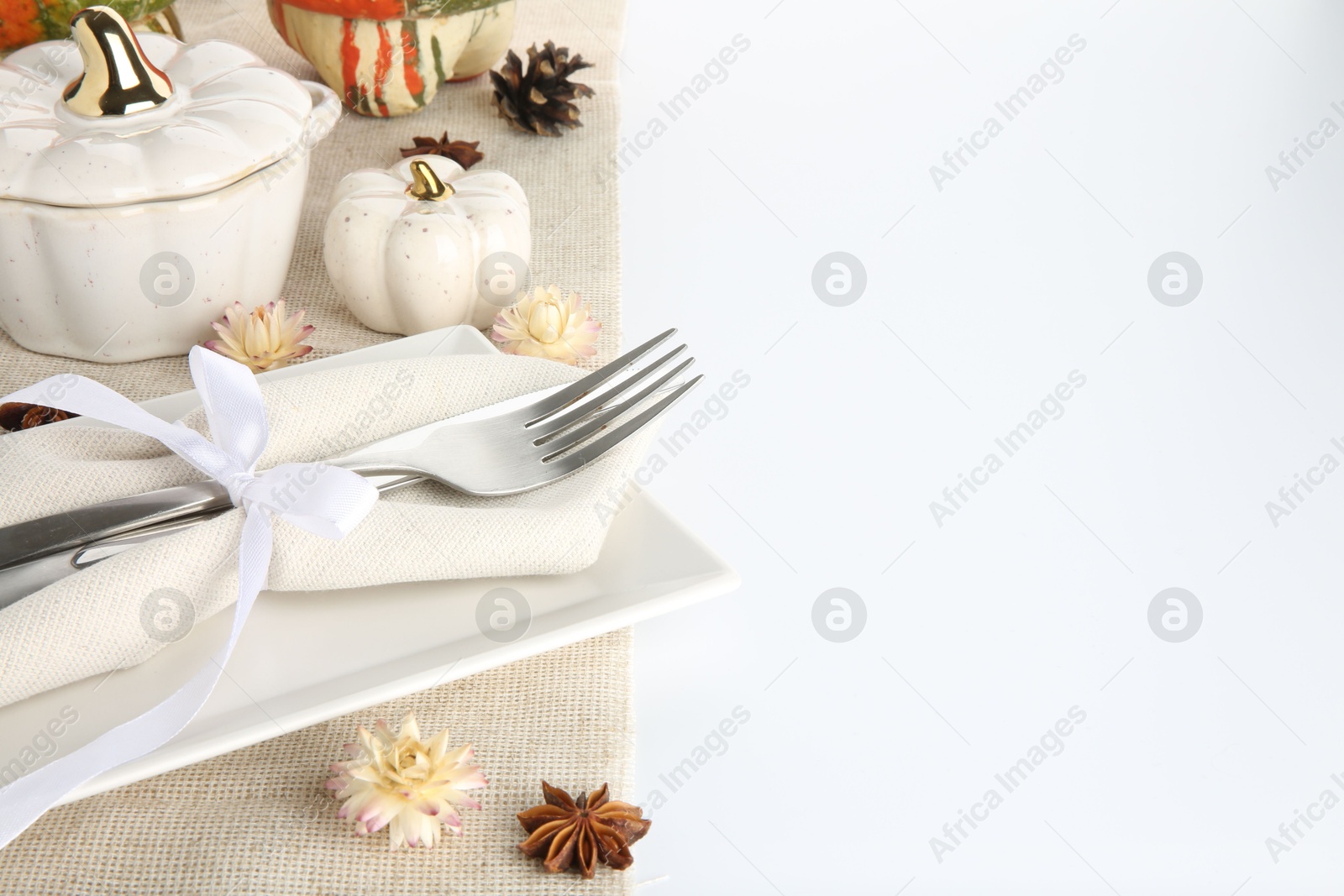 Photo of Beautiful table setting with autumnal decor on white background