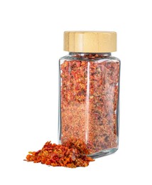 Photo of Red chili pepper flakes in glass jar isolated on white