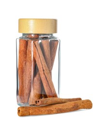 Photo of Cinnamon sticks in glass jar isolated on white