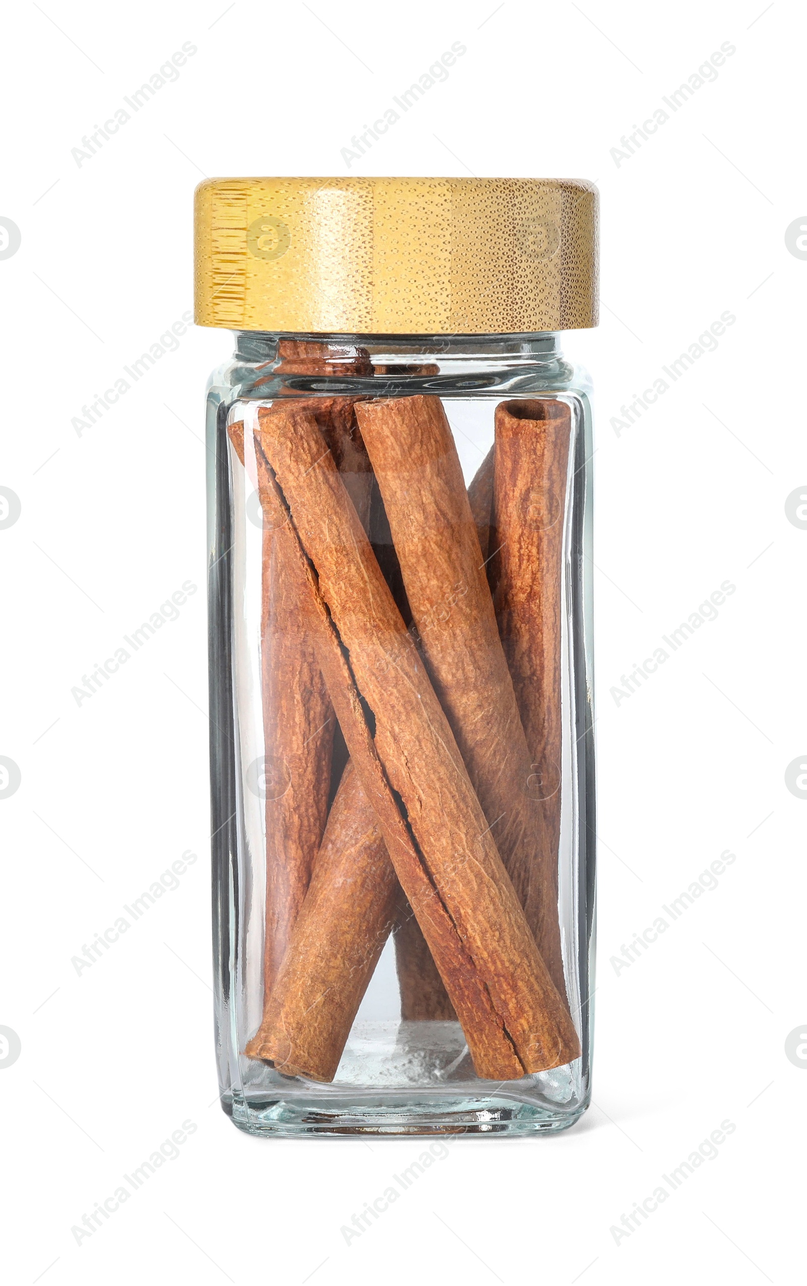 Photo of Cinnamon sticks in glass jar isolated on white