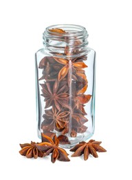 Photo of Anise stars in glass jar isolated on white