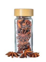 Photo of Anise stars in glass jar isolated on white