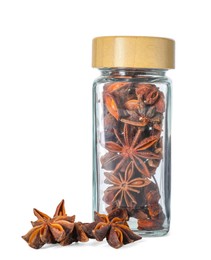 Photo of Anise stars in glass jar isolated on white