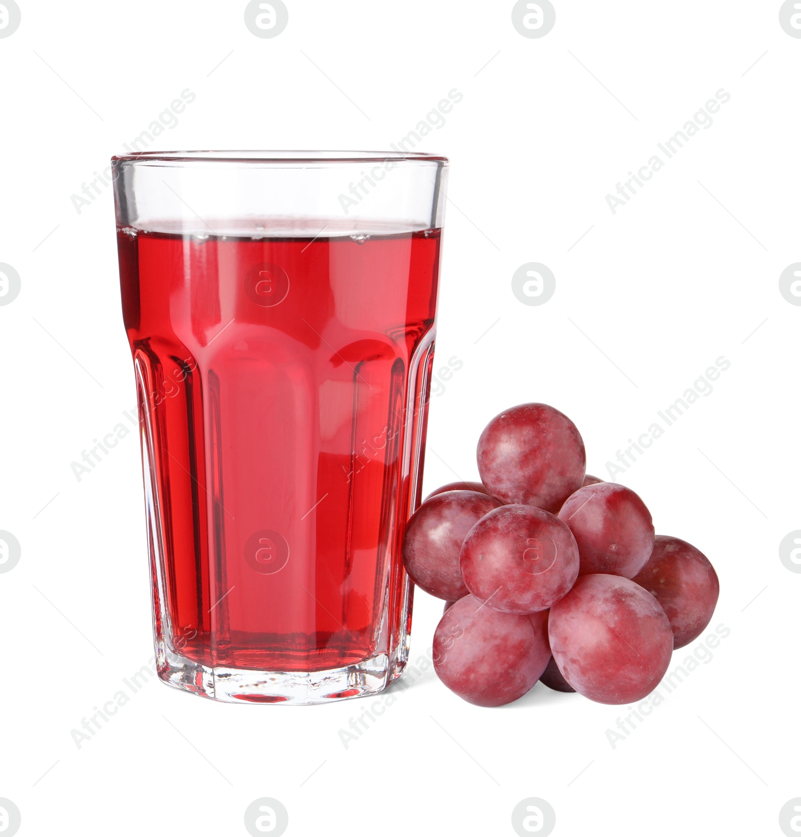 Photo of Tasty grape juice in glass and berries isolated on white