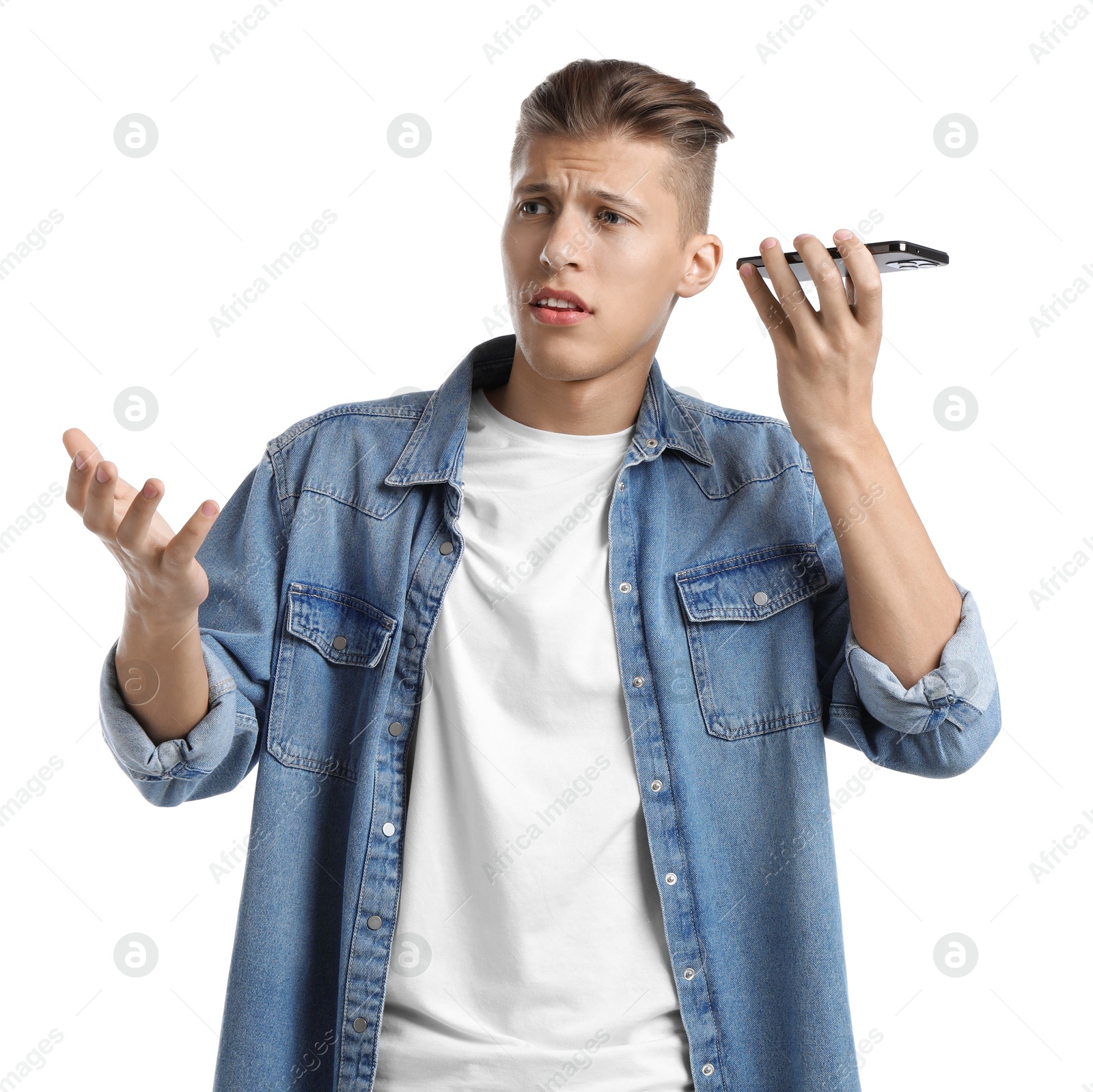 Photo of Young man with smartphone listening to voice message on white background