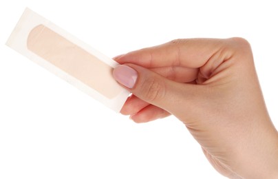 Photo of Woman holding medical adhesive bandage on white background, closeup