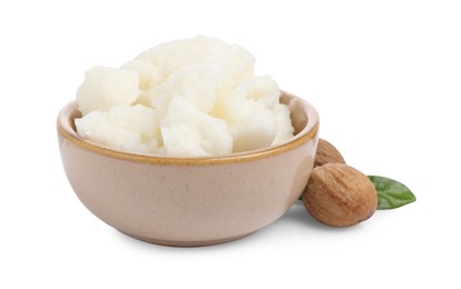 Photo of Shea butter in bowl and nuts isolated on white