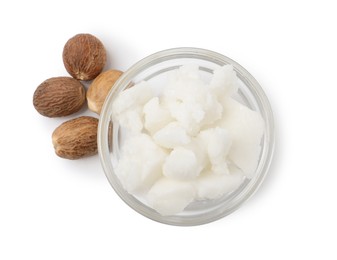 Photo of Shea butter in bowl and nuts isolated on white, top view