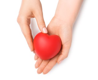 Photo of Woman with red decorative heart at white table, top view