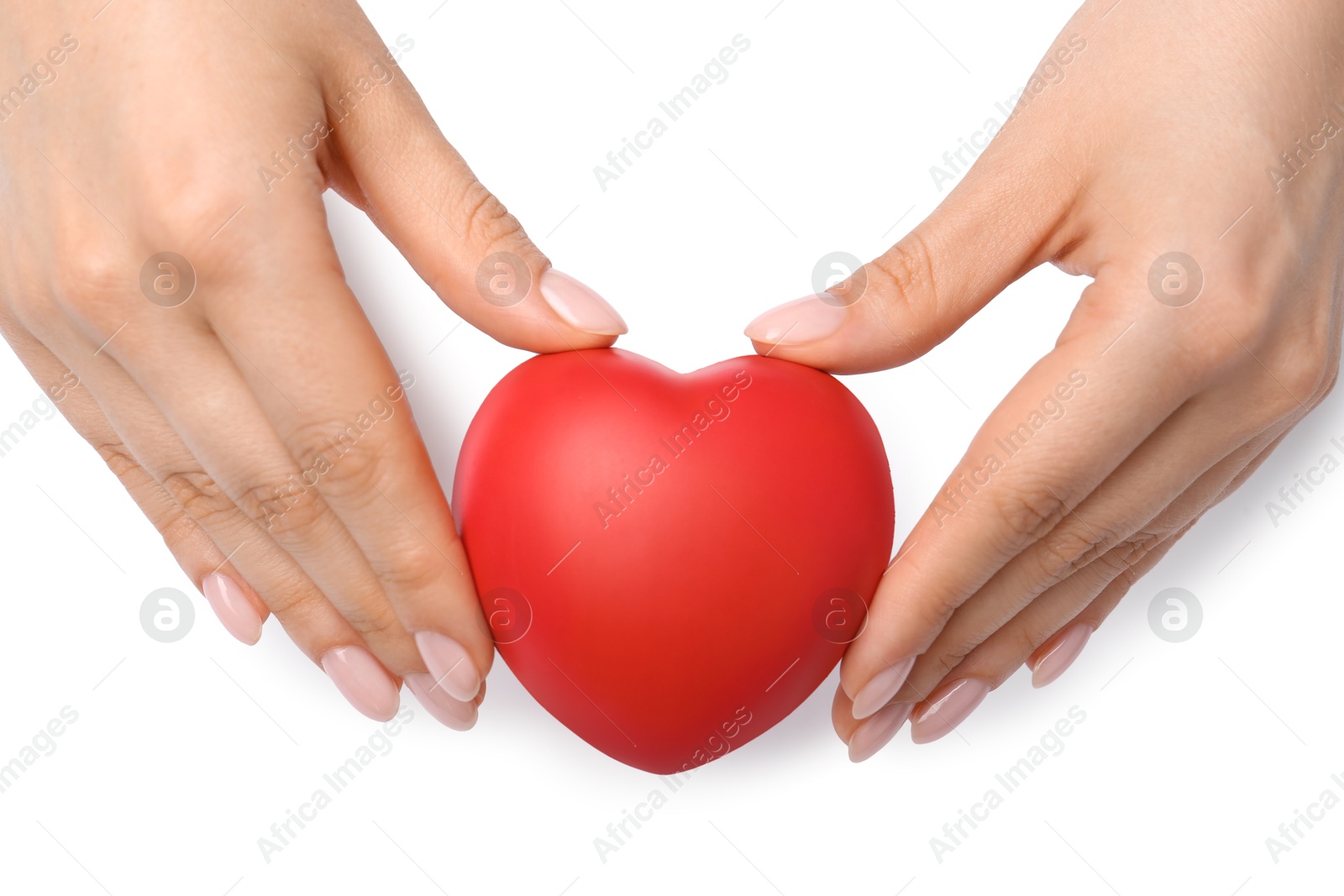 Photo of Woman with red decorative heart at white table, top view