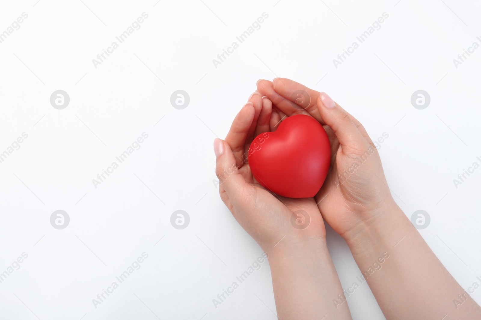 Photo of Woman holding red heart on white background, top view. Space for text