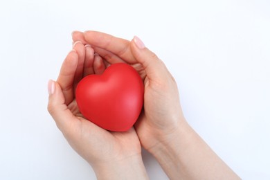 Photo of Woman holding red heart on white background, closeup