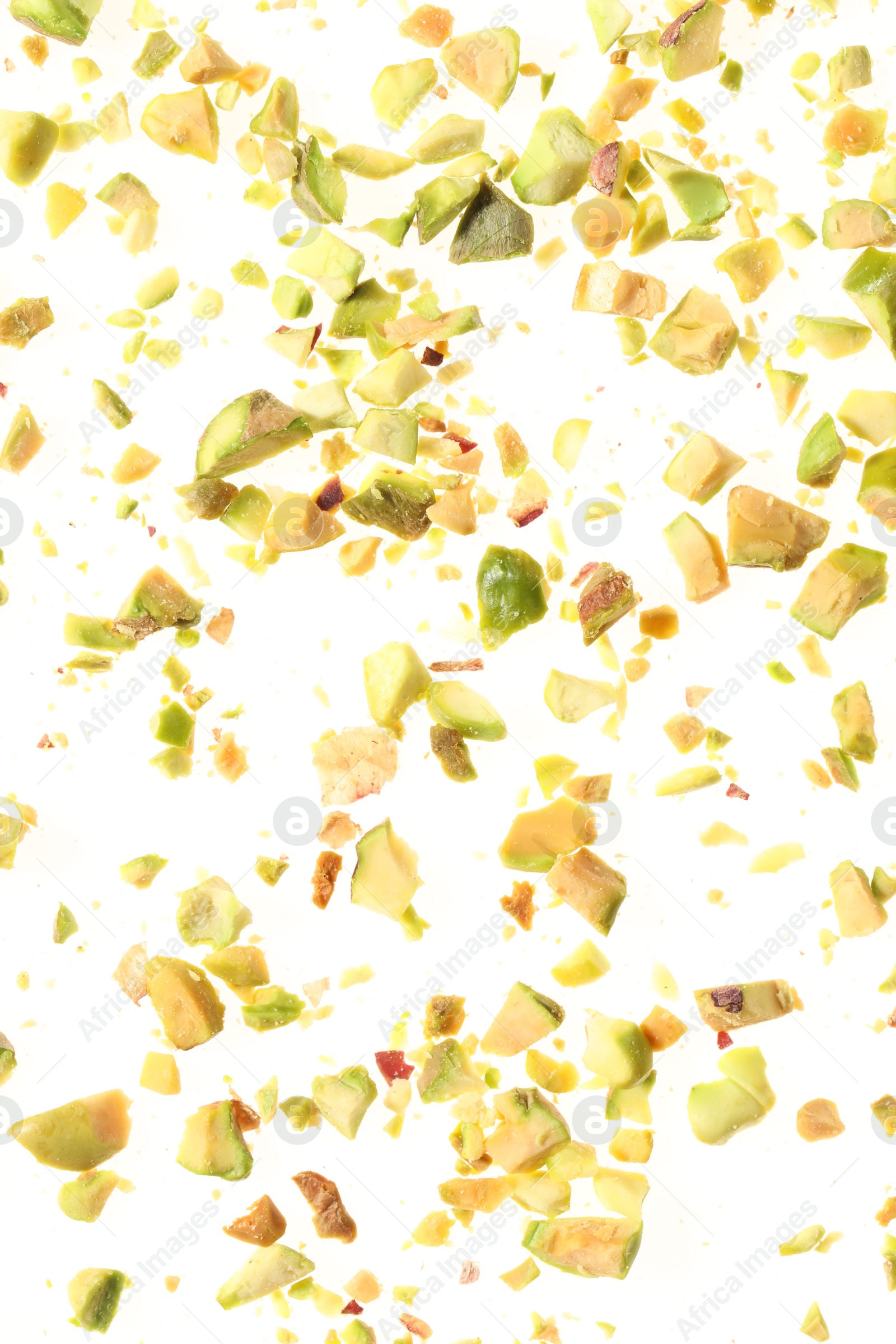 Photo of Pieces of peeled pistachio nut isolated on white