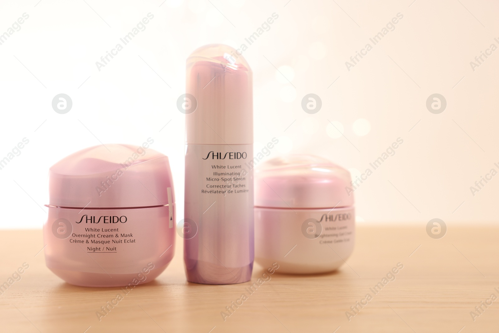 Photo of Leiden, Netherlands - June 11, 2024: Shiseido care cosmetic products on wooden table against light background, space for text