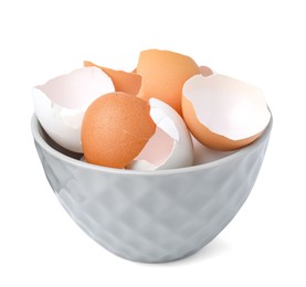 Photo of Broken eggshells in bowl isolated on white