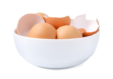 Photo of Broken eggshells in bowl isolated on white