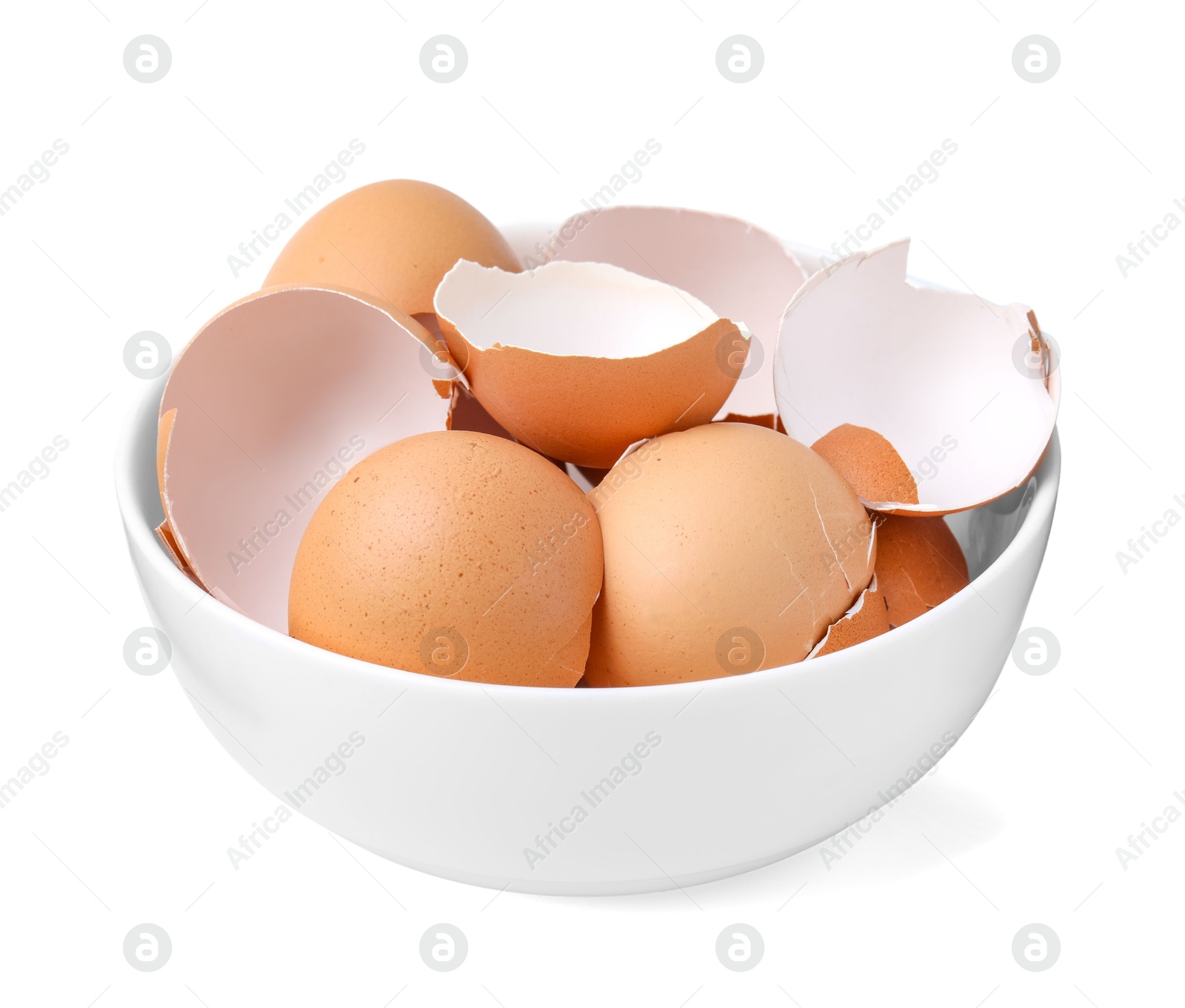 Photo of Broken eggshells in bowl isolated on white