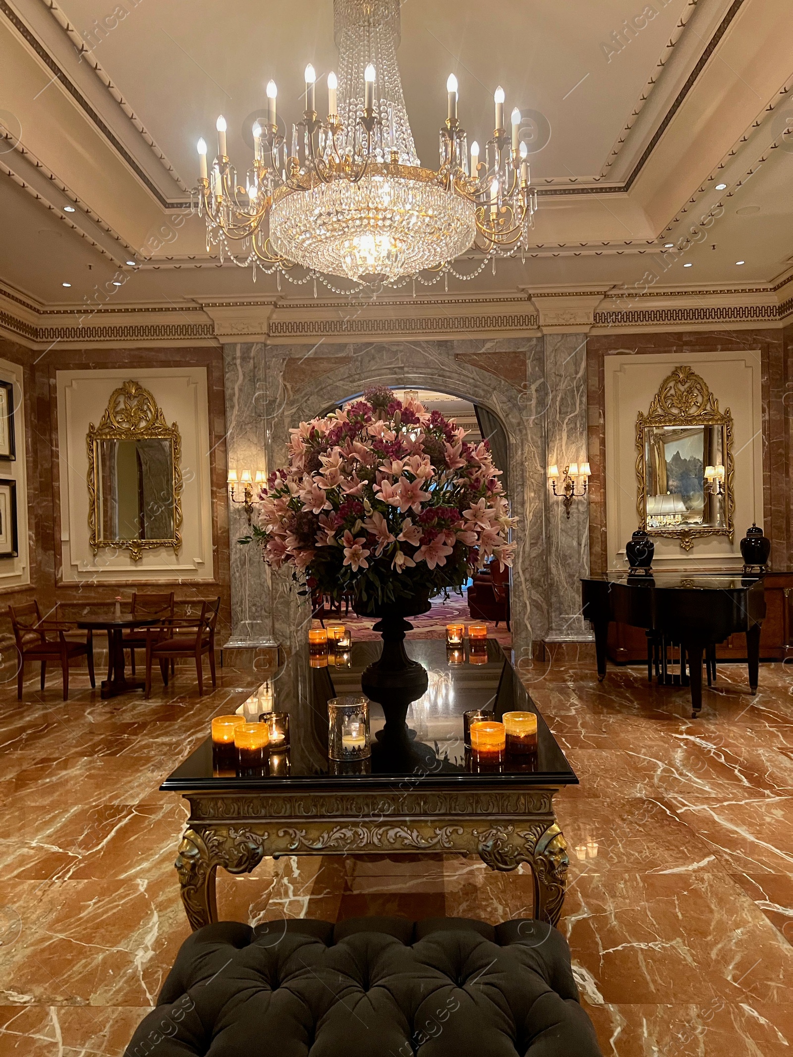 Photo of Berlin, Germany - July 1, 2024: Vase with beautiful flowers on mirrored table in Regent Berlin Hotel lobby