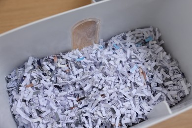 Photo of Shredded paper strips in bin, closeup view