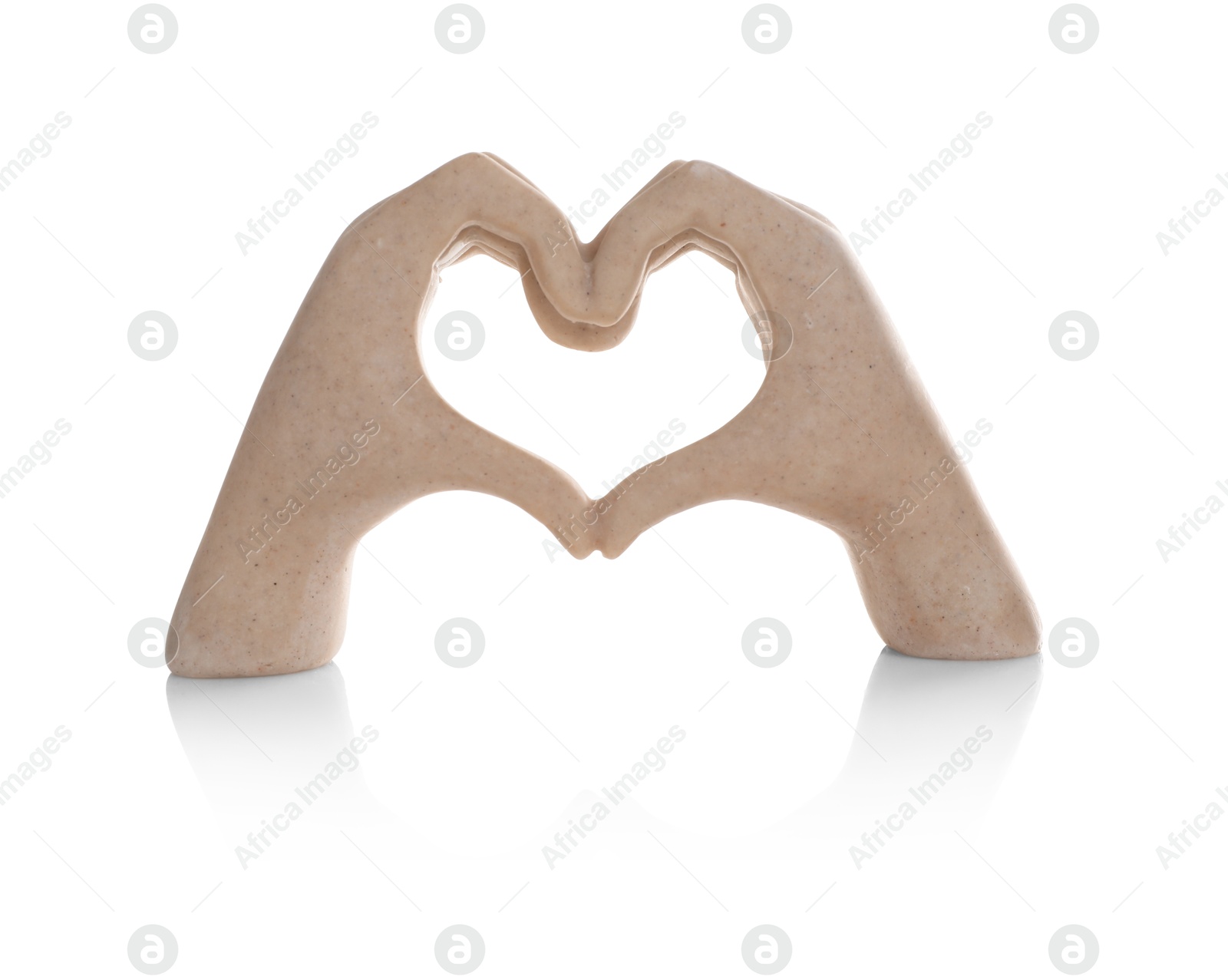 Photo of Decorative figure in shape of hands making heart isolated on white