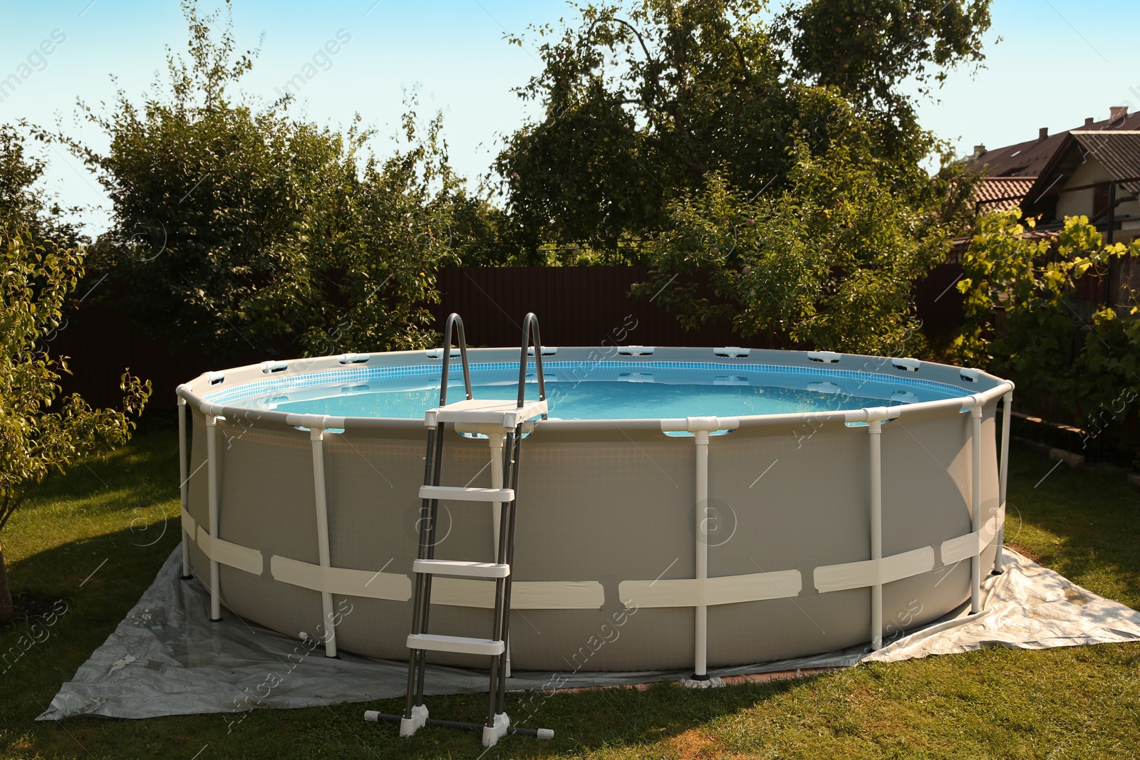 Photo of Above ground swimming pool outdoors on sunny day