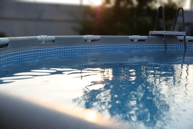 Above ground swimming pool outdoors on sunny day, closeup