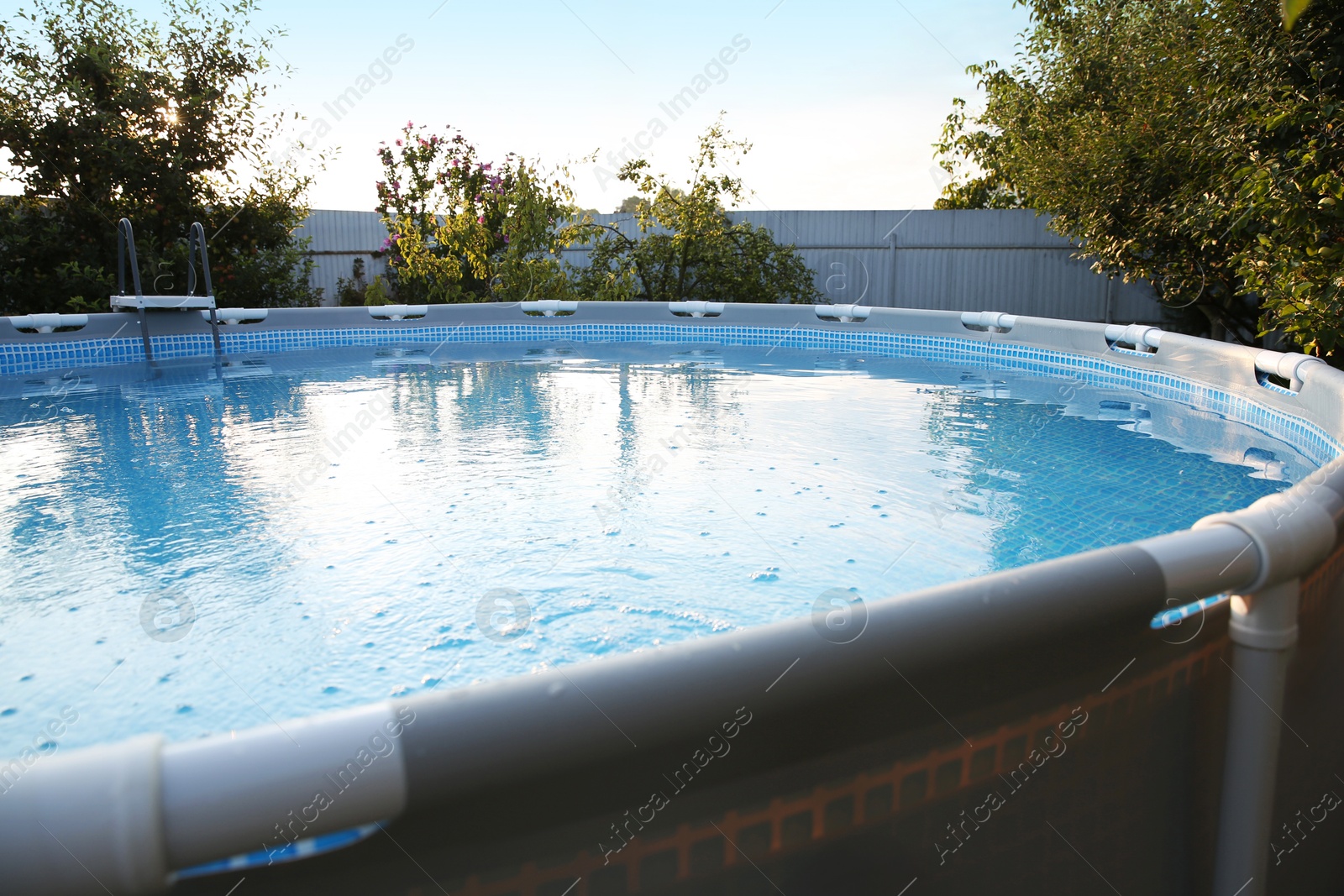 Photo of Above ground swimming pool in garden, closeup