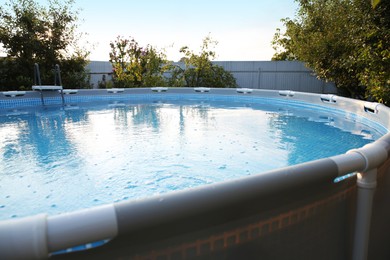 Above ground swimming pool in garden, closeup