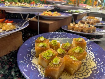 Photo of Different tasty desserts on table. Buffet service