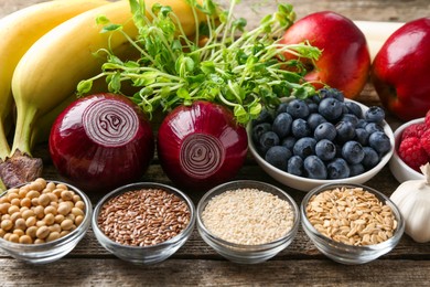 Different fresh products on wooden table. Source of prebiotics