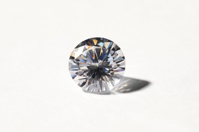 Beautiful shiny diamond on white background, closeup