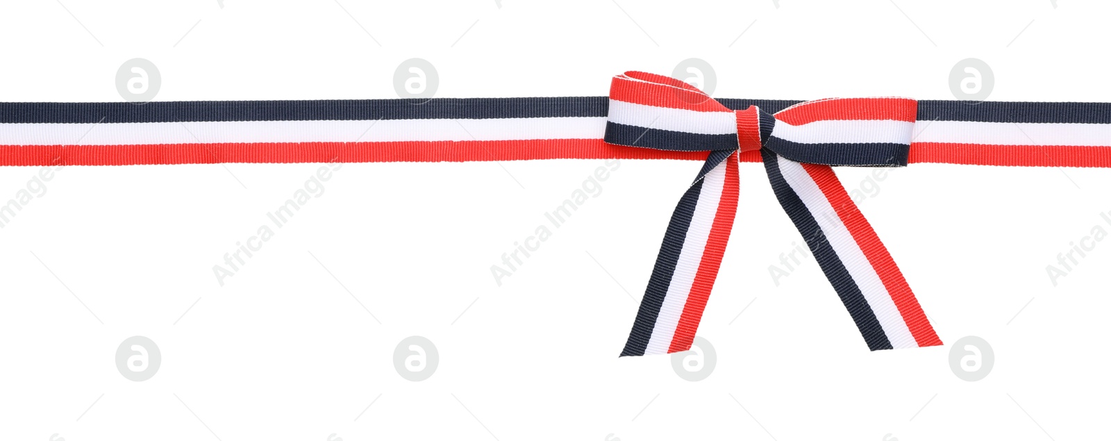 Photo of Ribbon with bow in colors of Yemeni flag isolated on white, top view