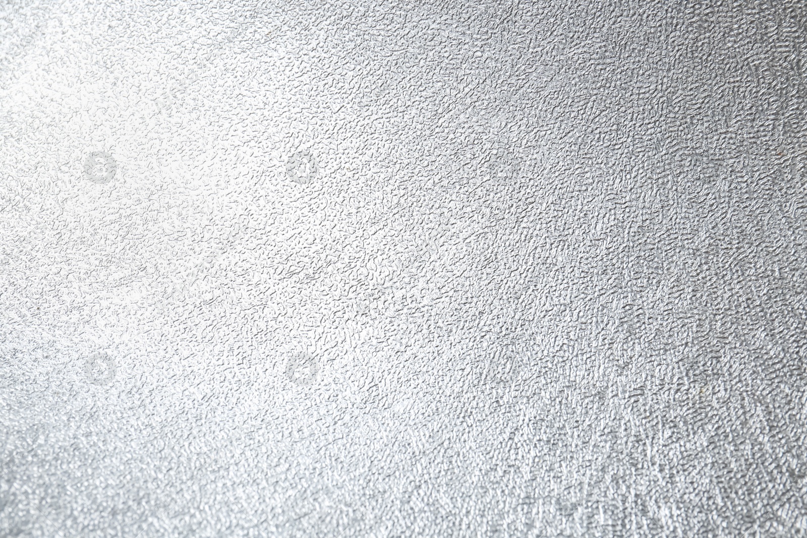 Photo of Shiny silver surface as background, closeup view