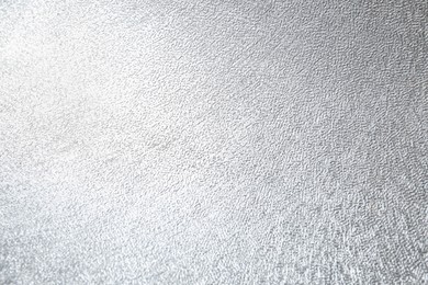 Shiny silver surface as background, closeup view