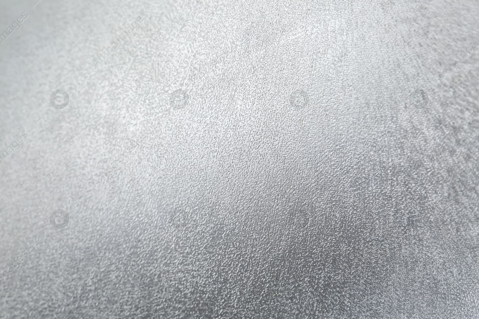 Photo of Shiny silver surface as background, closeup view