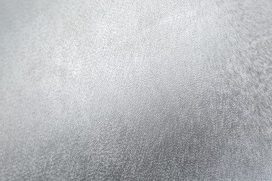 Photo of Shiny silver surface as background, closeup view