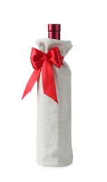 Photo of Wine bottle in burlap package with red ribbon isolated on white