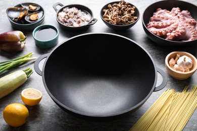 Photo of Ingredients for wok on grey table, closeup