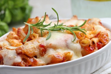 Photo of Delicious al forno pasta in baking dish on table, closeup