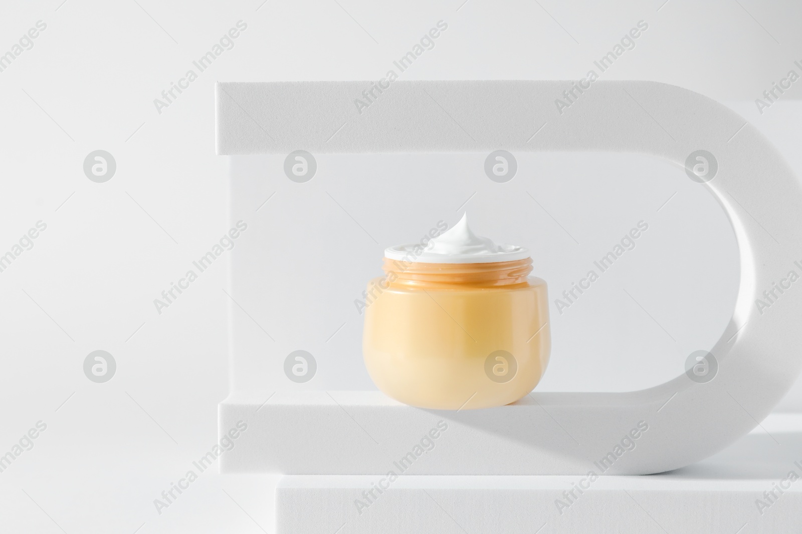 Photo of Stylish presentation of facial cream on white background