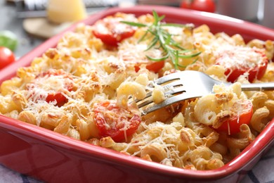 Photo of Delicious al forno pasta in baking dish on table, closeup