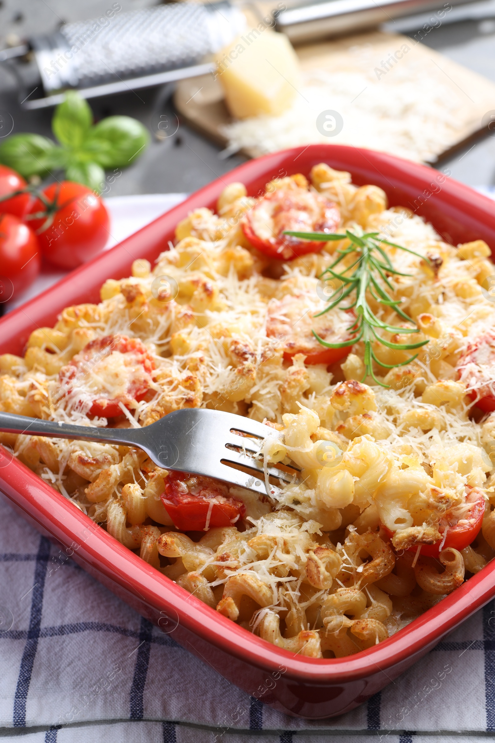 Photo of Delicious al forno pasta in baking dish on table, closeup