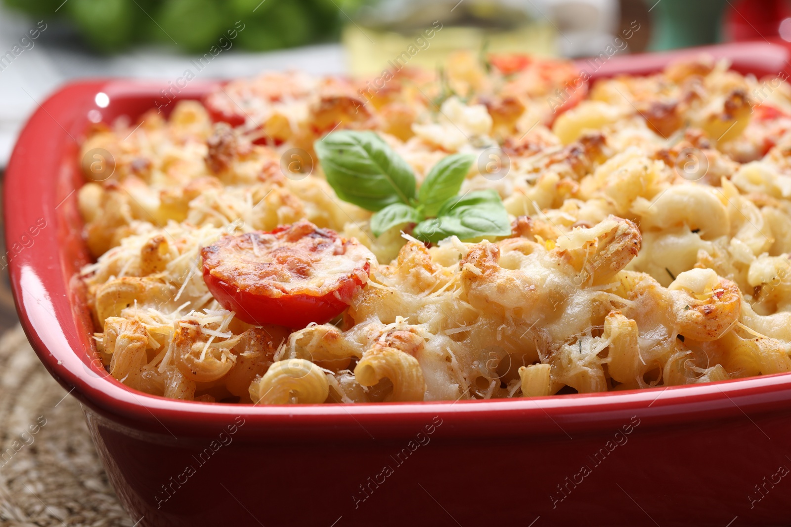 Photo of Delicious al forno pasta in baking dish on table, closeup