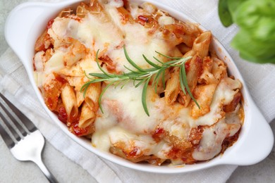 Photo of Delicious al forno pasta in baking dish on light table, top view