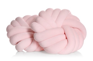 Photo of Pink cushions in shape of knot isolated on white