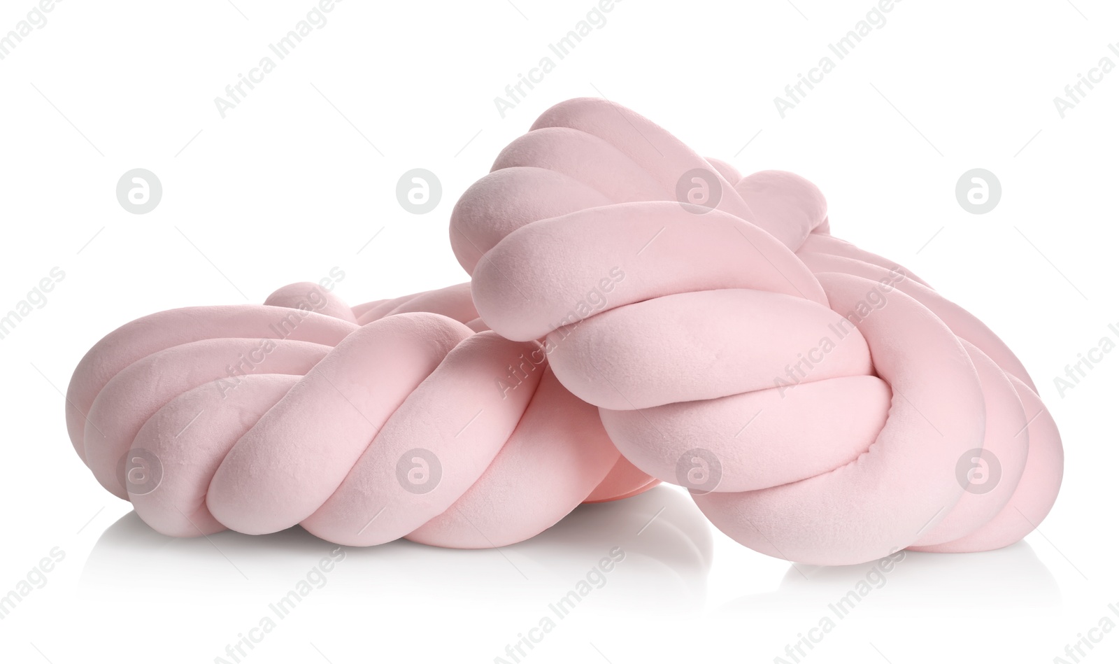 Photo of Pink cushions in shape of knot isolated on white