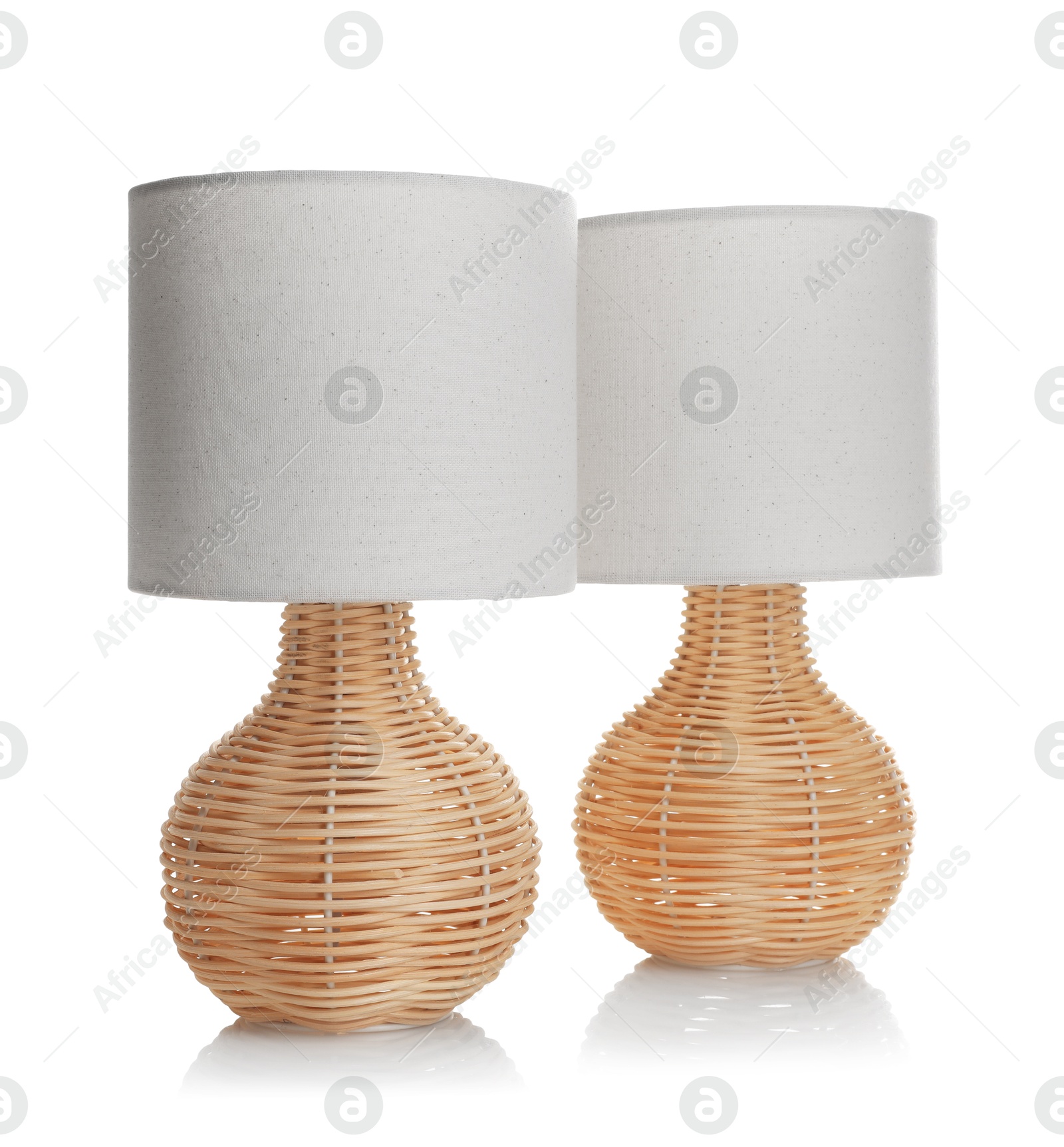 Photo of Stylish elegant night lamps isolated on white