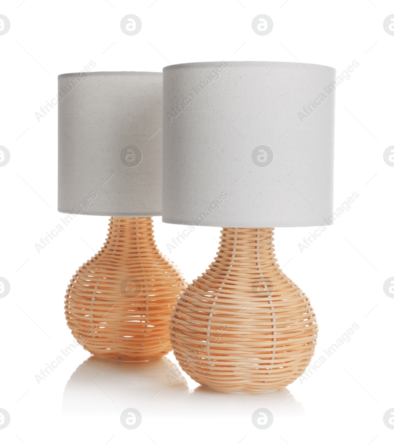 Photo of Stylish elegant night lamps isolated on white