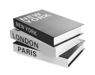 Stack of hardcover books with different cities names isolated on white